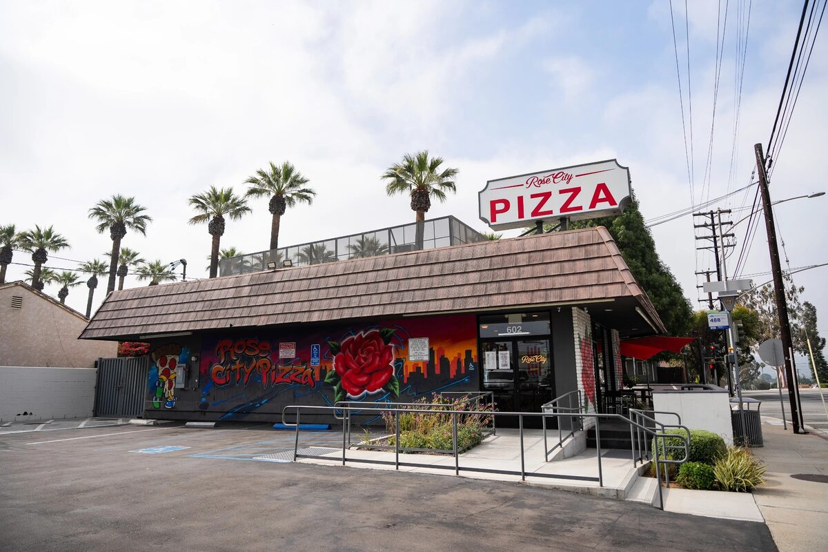 Rose City Pizza storefront with the restaurant sign visible.